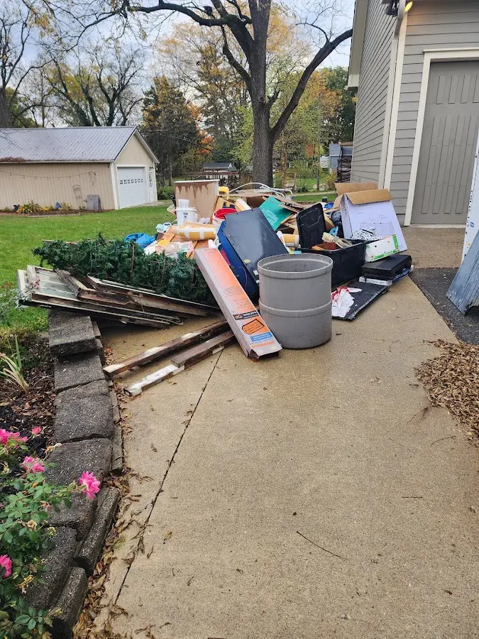Dumpster being loaded with debris for 30 Yard Dumpster Rental in Purcellville